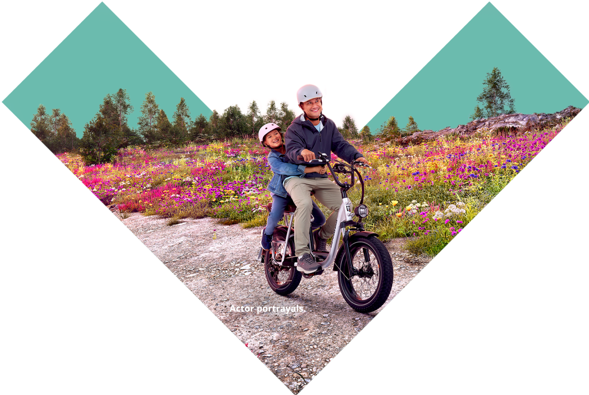 Father and daughter riding a bike